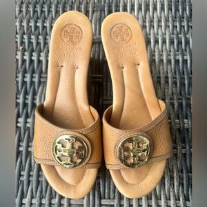 Tory Burch wedge slide sandals.